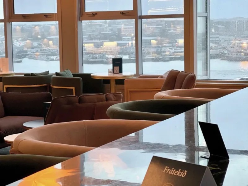 The lounge at Betri Stofan with a view over Hafnarfjörður harbour